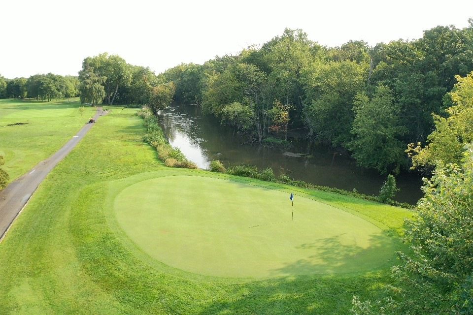Arial view of course greens with river view 